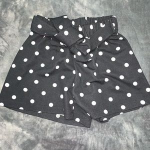 Polka dot shorts.